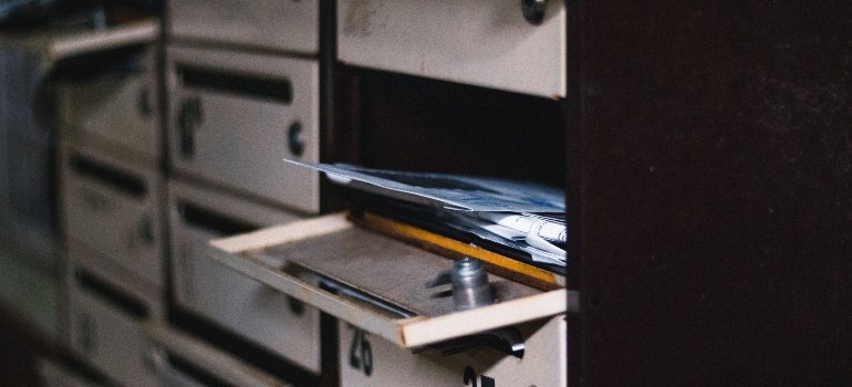 A mailbox filled with mail.