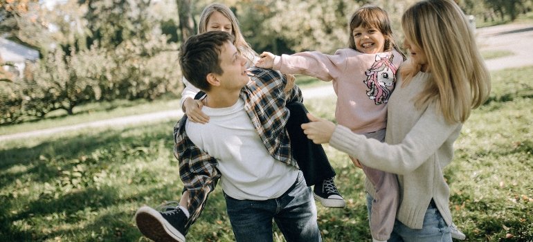 A family enjoying in a park, answering the question "is Fort Worth a good place to live?"
