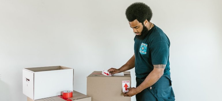 A mover packing boxes.